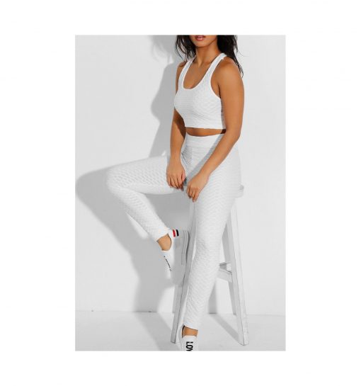Ensemble de sport pour femme avc legging et brassiere top push up blanc pose